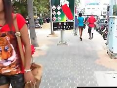 Asian teen is giving this pervert tourist a naughty blowjob!